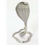 A white metal menu holder / table place card holder formed as a cobra / snake. approx 2 1/2" high