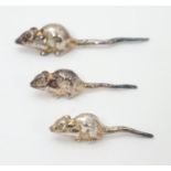 Three white metal miniature novelty models of mice. indistinctly marked. The largest 1 1/2" long (3)