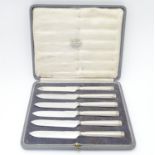 A cased set of 6 Art Deco silver handled tea knives. Hallmarked Sheffield 1922 maker Thomas Bradbury