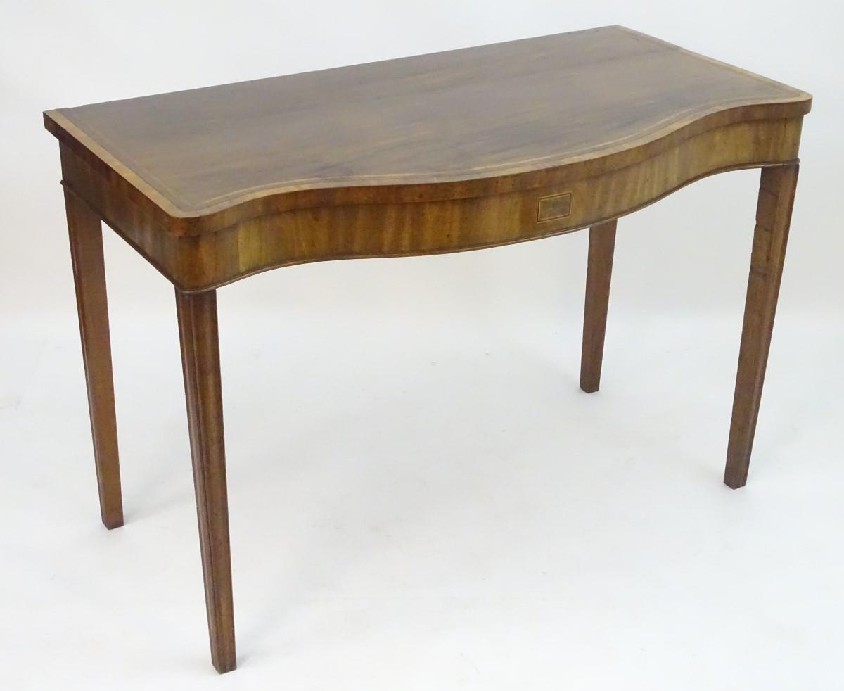 An early 19thC mahogany serving table with a serpentine shaped front, crossbanded top and having - Image 3 of 17