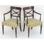 A pair of Regency mahogany open armchairs with curved reeded backrests and arms, crinoline style