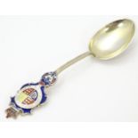 A Victorian silver gilt souvenir spoon with enamel decoration depicting shield and motto Honi soit