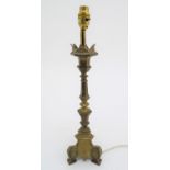 A late 19th / early 20thC cast table lamp with castellated top. Approx. 19 1/2" high overall. Please