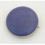 Ruskin Pottery : A silver brooch set with Ruskin Pottery cabochon . Marked to reverse ' Ruskin