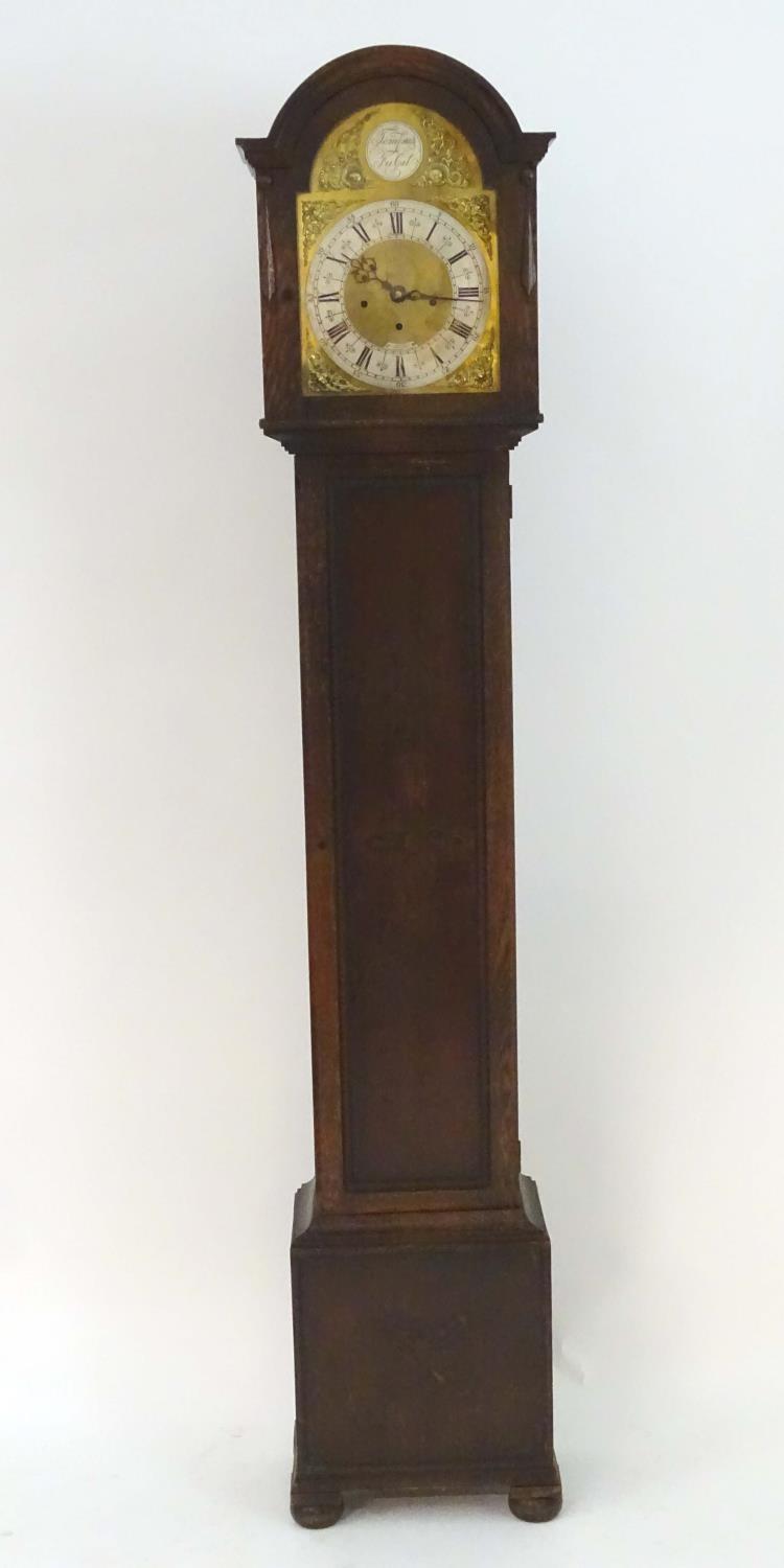 A c.1920 longcase / grandmother clock having an 8 day movement, Westminster chimes, having an ornate