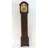A c.1920 longcase / grandmother clock having an 8 day movement, Westminster chimes, having an ornate