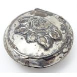 A Danish silver compact with hammered decoration and floral detail to lid. Marked for Copenhagen