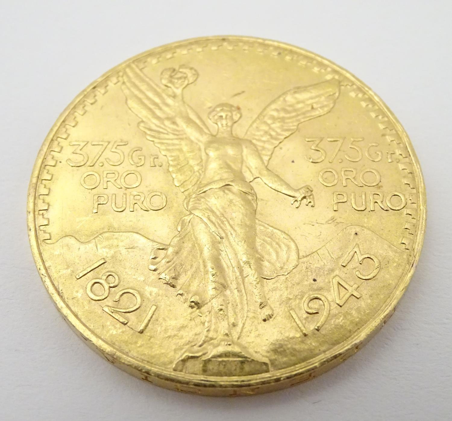 A 1943 gold 50 pesos coin commemorating Mexico's 100th anniversary of independence from Spain. The - Image 9 of 10