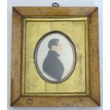 A 19thC oval watercolour and gouache portrait miniature / silhouette of a gentleman, Timothé