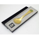 A Georg Jensen Danish sterling silver gilt and enamel 1975 year spoon decorated with woodruff plant.