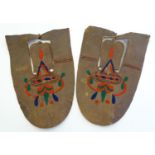 A pair of native American Indian leather moccasin shoe covers with embroidered decoration. Approx.