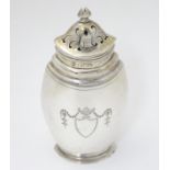 A silver sugar caster / shaker / muffineer of ovoid form with engraved decoration, hallmarked London