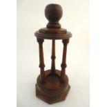 Treen: A 20thC carved wooden stand, with three columns surmounted by a knop. Approx. 20" tall Please
