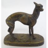 A late 19th / early 20thC cast model of a greyhound dog mounted on an oval base. Approx. 4 1/2" high