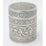A white metal canister with floral and acanthus scroll decoration 3 1/2" high Please Note - we do