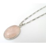 A silver pendant set with rose quartz cabochon, Hallmarked London 1986 maker Tony Bestwick approx 1"