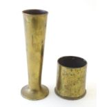 Militaria: two items of Trench art, comprising a brass vase and mantle ornament formed from a 1934