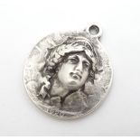 A white metal pendant inspired by an American coin. 1 1/4" diameter Please Note - we do not make