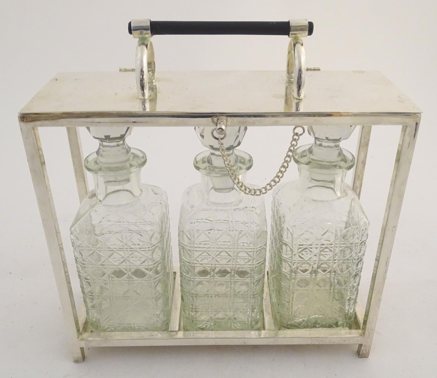 A Dr Christopher Dresser style tantalus with provision for three decanters. Approx. 11 1/2" high - Image 7 of 27