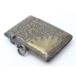 A silver vesta case with engraved foliate decoration, hallmarked Chester 1909, maker Payton,