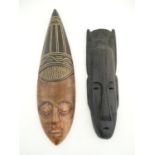Ethnographic / Native / Tribal: Two carved elongated face masks with incised detail. The largest