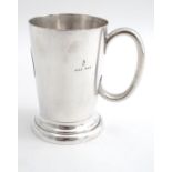 A silver plate half pint mug. 4 1/4" high Please Note - we do not make reference to the condition of