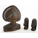 Ethnographic / Native / Tribal: A carved wooden bust of a woman wearing a headdress with incised