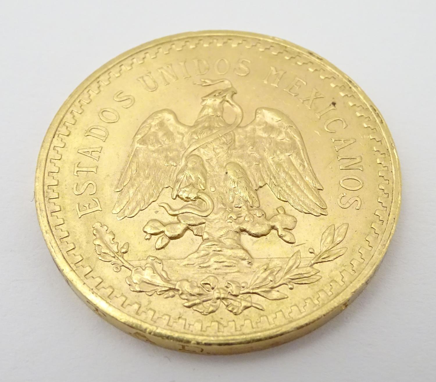 A 1943 gold 50 pesos coin commemorating Mexico's 100th anniversary of independence from Spain. The - Image 5 of 10