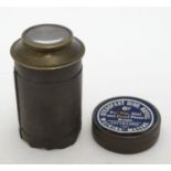 A small circular tin containing Steadfast disc refills by Watkins' Meters for Bee, Dial and Focal