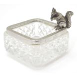 A glass dish with sterling silver mount and squirrel decoration. Approx. 2 3/4" wide Please Note -