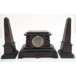 A 19thC Egyptian revival mantel clock with an 8-day movement, the case and garnitures of marble