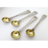 A Victorian set of four Old English Thread pattern salt spoons with gilded bowl engraved armorial to