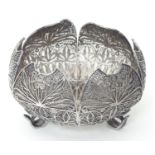 A white metal dish with filigree decoration. Approx 4 diameter Please Note - we do not make