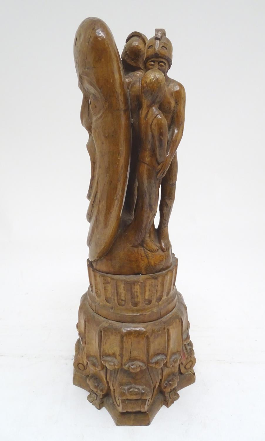 A 20thC carved wooden sculpture titled Tragic Muse to base, monogrammed TD and dated 1971 to side.