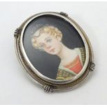 A Continental .800 silver brooch set with hand painted portrait miniature 1 1/4" long Please