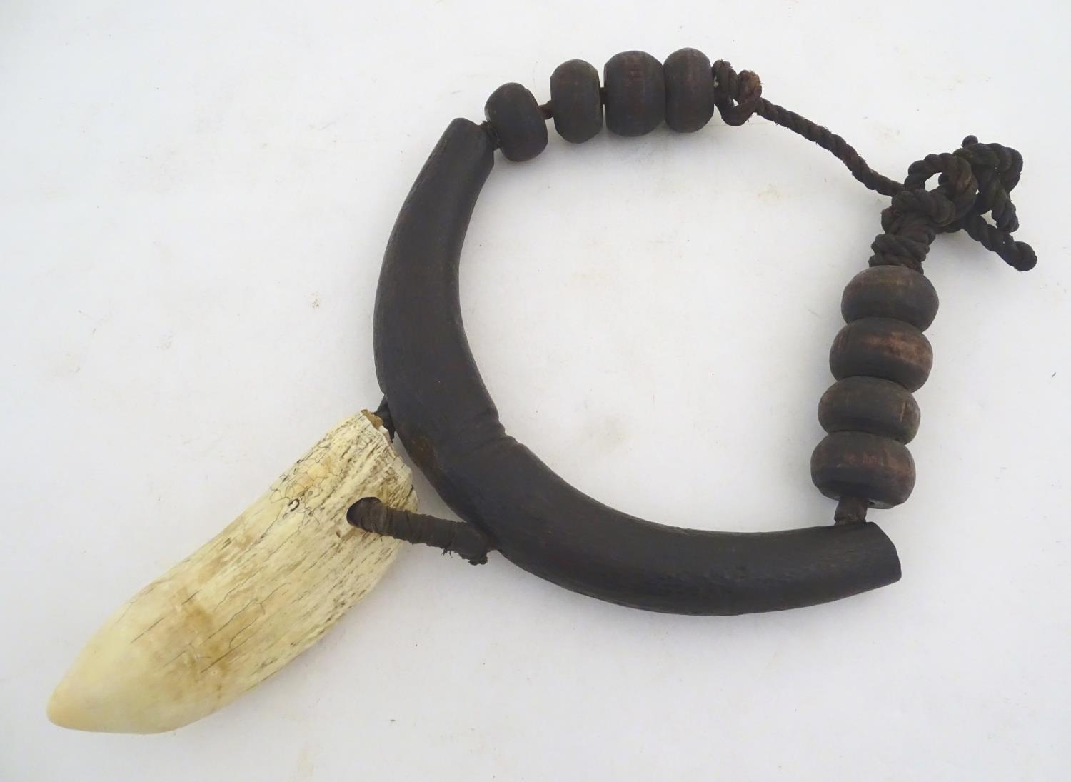 Ethnographic / Native / Tribal: A tribal breastplate necklace with palmwood roundels and whale tooth - Image 5 of 13