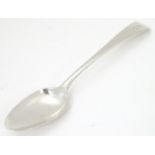A white metal spoon marked IM. Possibly Scottish provincial silver ( John Mackie of Ellon) 7" long
