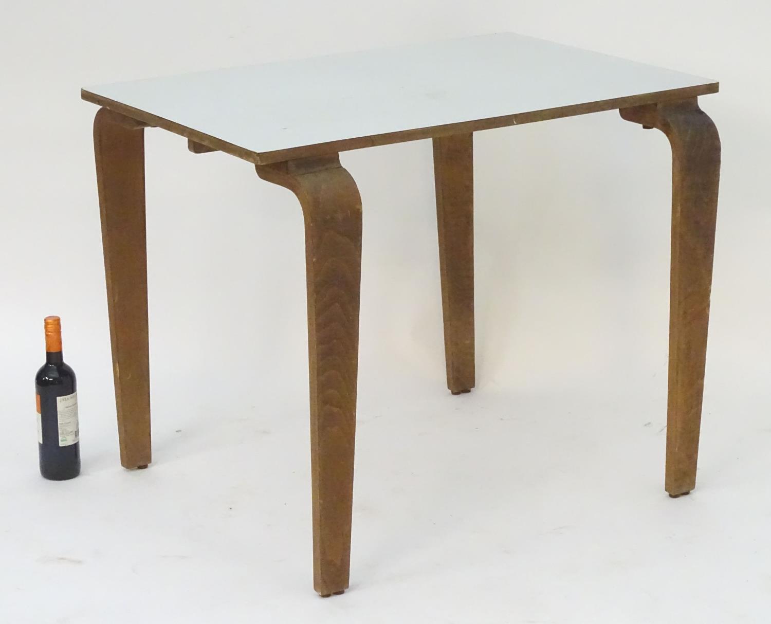 A mid 20thC table with a rectangular top above shaped tapered oak legs. 36" long x 24" wide x 29" - Image 10 of 13