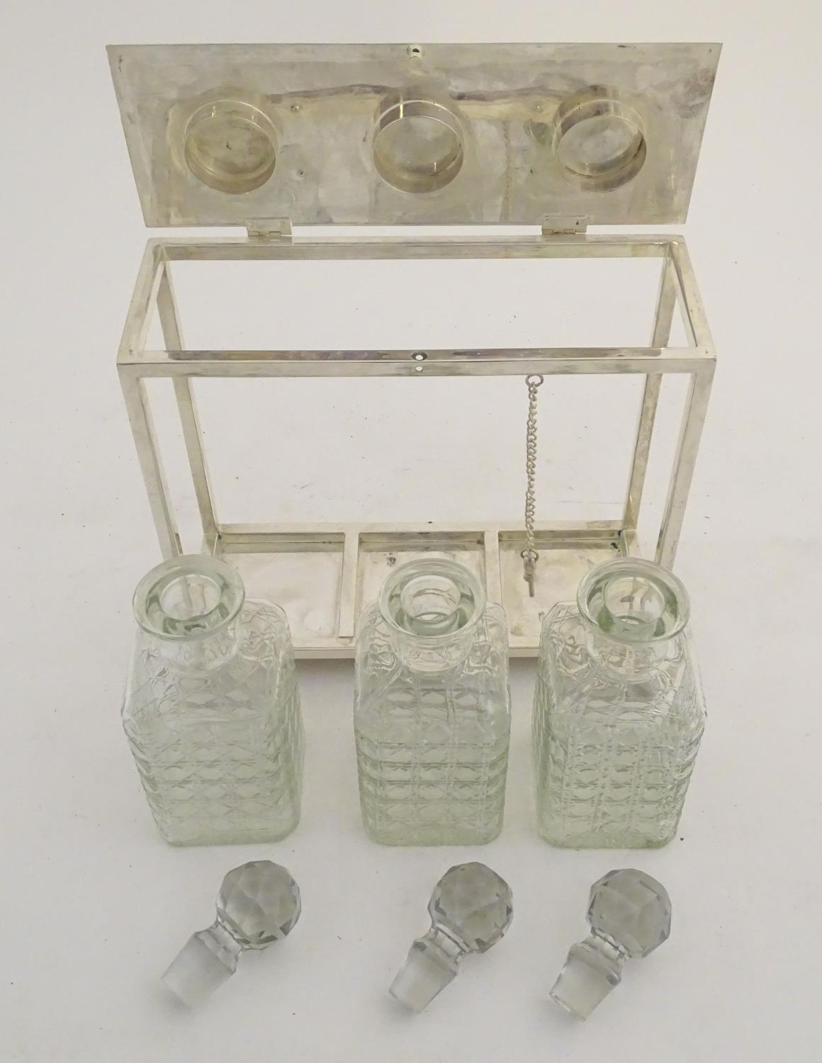 A Dr Christopher Dresser style tantalus with provision for three decanters. Approx. 11 1/2" high - Image 14 of 27