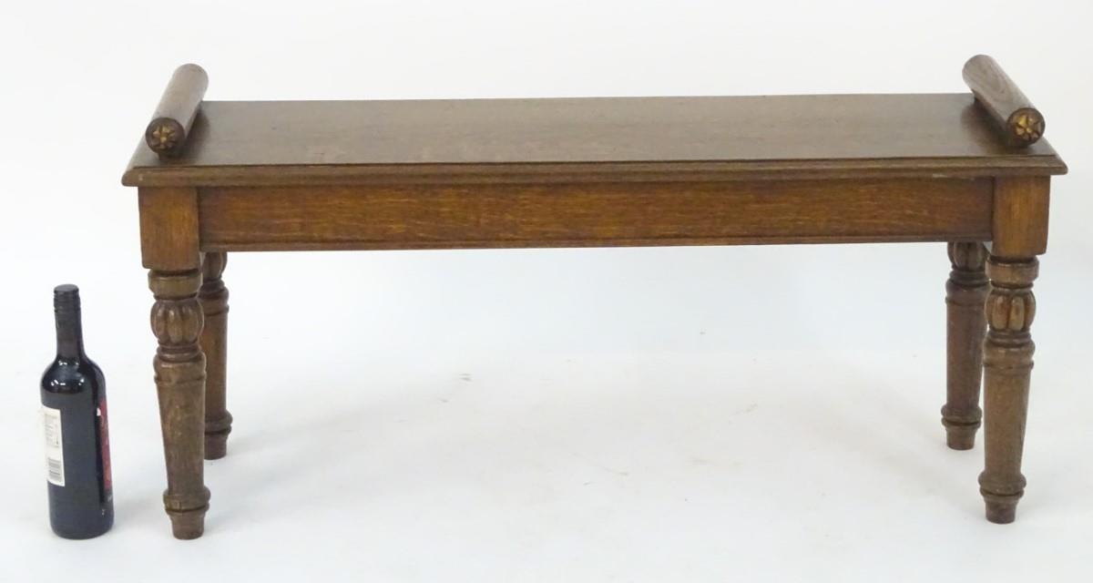 A late 19thC / early 20thC oak hall bench raised on turned tapering legs with gadrooned sections. - Image 2 of 7