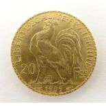 A French Republic 20 franc gold coin, 1909, approx. 6.45g Please Note - we do not make reference