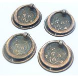 Four Art Nouveau ring pull handles / door furniture with floral decoration. Approx. 3" long.