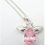 A silver pedant and chain, the pendant formed as a winged insect set with white and pink stone