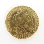 A French Republic 20 franc gold coin, 1911, approx. 6.45g Please Note - we do not make reference