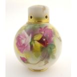 An early 20thC Royal Worcester pot pourri and cover of globular form, with rose decoration. Bears