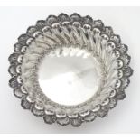 A Victorian silver bon bon dish of circular form with embossed decoration. Hallmarked Chester 1895