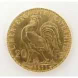 A French Republic 20 franc gold coin, 1911, approx. 6.45g Please Note - we do not make reference