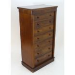 A 19thC mahogany Gillows Style Wellington chest with a moulded rectangular top above seven graduated