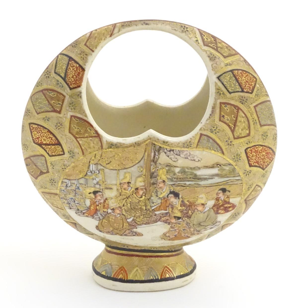 A Japanese satsuma moon basket vase with hand painted decoration depicting figures seated around - Image 2 of 20