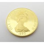 A 1980 gold Isle of Man crown commemorating the Queen Mother?s 80th Birthday. Approx. weight 8.26g